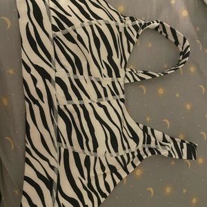 Dip zebra print sports bra